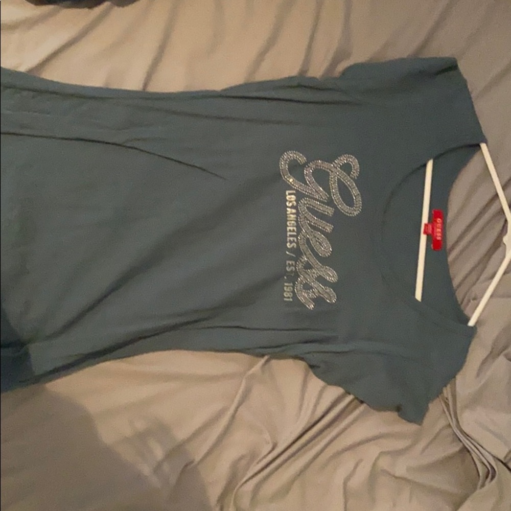 a blue guess shirt